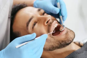 Dental hygiene – examination of a patient's teeth at HAPPYDENT
