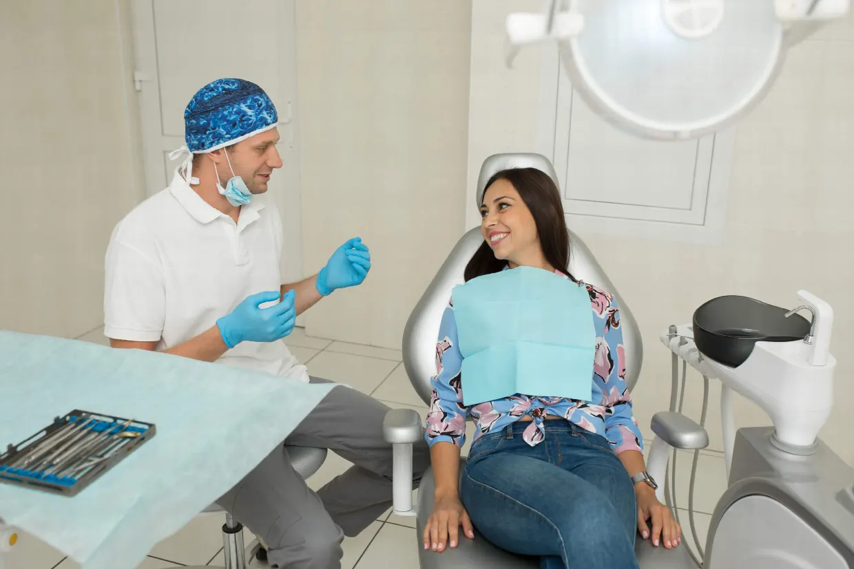 Dentist discussing tooth decay treatment with a patient