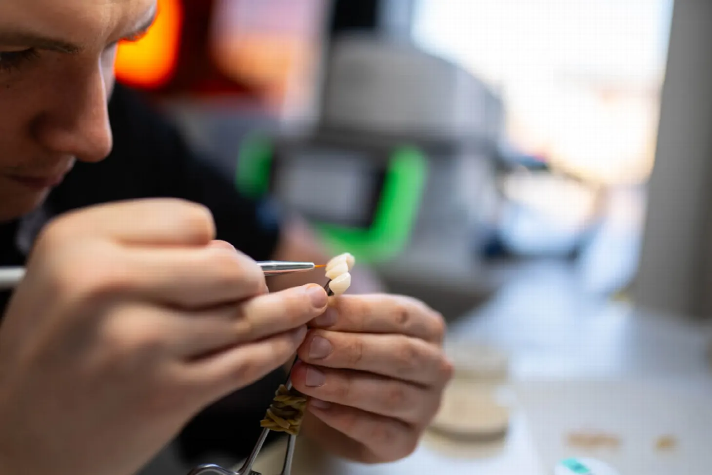Dr. Michal Repaši during a consultation about mini implants