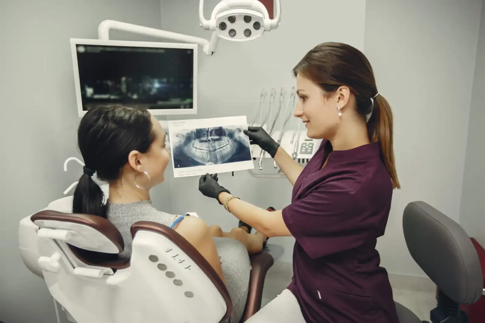 Consultation over an X-ray before a full teeth reconstruction